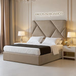 Load image into Gallery viewer, Beige upholstered bed with matching headboard in a bedroom setting, featuring &#39;Beds N Boards&#39; branding.
